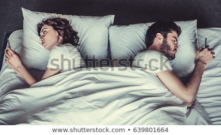 Сток-фото: Bored Couple Husband And Wife In Bedroom