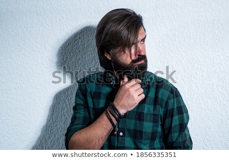 Foto stock: Caucasian Man Wearing Checkered Shirt And Trendy Hairstyle