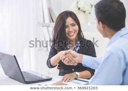 Foto stock: Businesswoman Shaking Hands With Her Partner