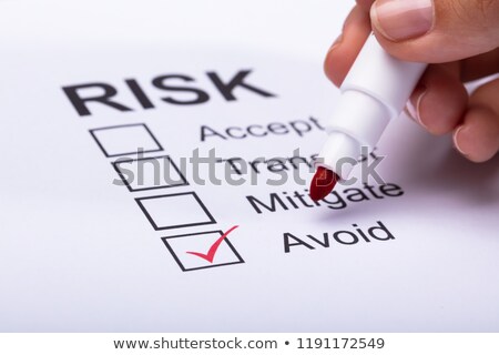 Stock fotó: Woman Ticking Avoid Option On Risk Form