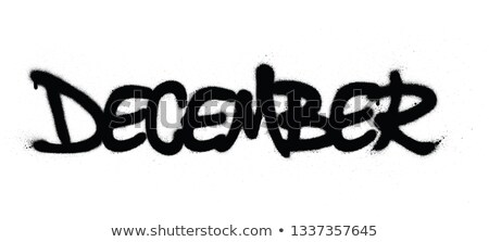 Stockfoto: Graffiti December Word Sprayed In Black Over White