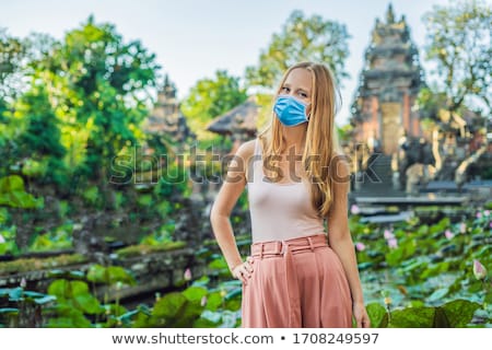 Stock fotó: Young Woman Traveler In The Background Of Pura Taman Kemuda Saraswati Temple In Ubud Bali Island I