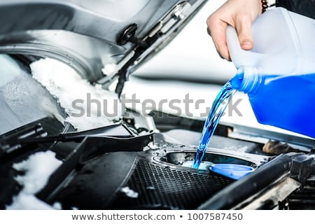 Stock fotó: Filling The Tank Of Windshield Washer Fluid