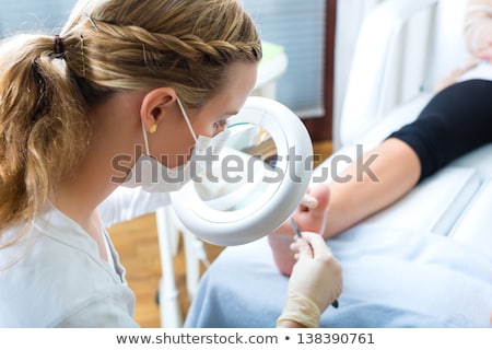 Woman In Nail Studio Receiving Pedicure Stockfoto © Kzenon