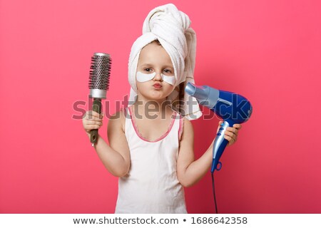 Stock fotó: Hairdresser Holding Brush And Hairdryer