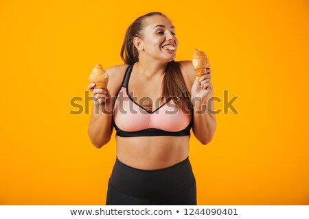 Stockfoto: Image Of Healthy Woman In Tracksuit Holding Two Croissants In Bo