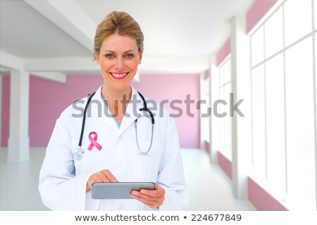 Stok fotoğraf: Breast Cancer Doctor On Tablet And Women With Pink Awareness Ribbons