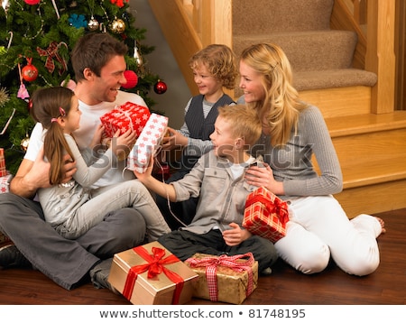 Stock foto: Happy Family Celebrates Christmas Mom Dad And Son In Christmas Decorations