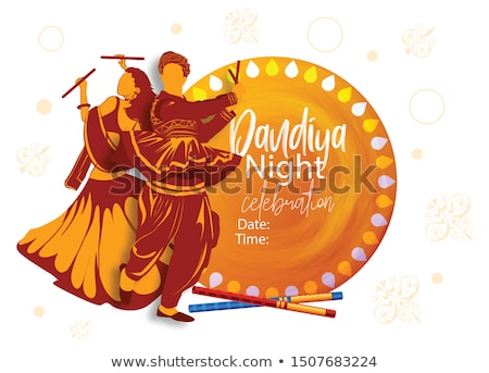 Foto stock: Couple Playing Dandiya In Disco Garba Night Banner Poster For Navratri Dussehra Festival Of India