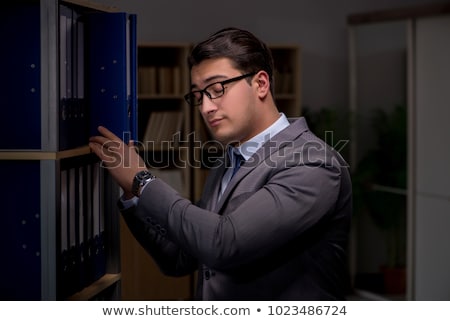 [[stock_photo]]: Businessman Almost Falling Asleep Working Late Hours In The Offi