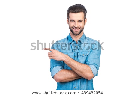 Stok fotoğraf: Young Smiling Man Pointing