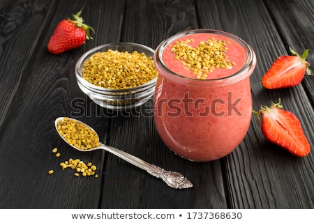 [[stock_photo]]: Bee Pollen In Glass Jar And Wooden Spoon
