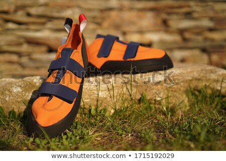 Stockfoto: Close Up Of Red Rubber Climbing Shoe On Rock