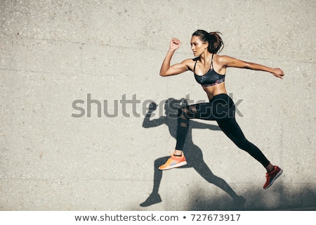 Zdjęcia stock: Young Female Fitness Model Running