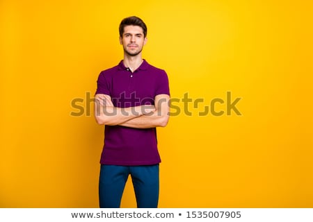 Сток-фото: Pensive Young Man With Arms Folded Standing Over White Background