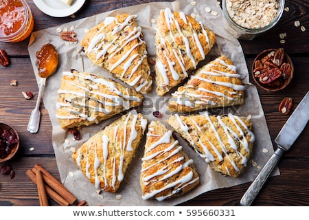 Stok fotoğraf: Scones With Oats Cranberry And Pecan Nuts On Wooden Background Top View