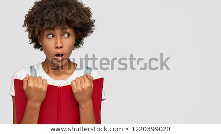 Stock photo: Shocked Girl Reading A Book