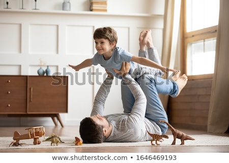 Stok fotoğraf: Happy Little Kids Lying On Floor Or Carpet