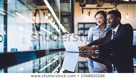 Foto stock: African American Businessman Sitting At The Computer In Startup Office