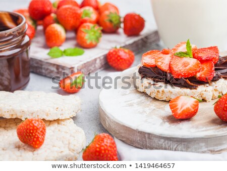 Stockfoto: Healthy Organic Rice Cakes With Chocolate Butter And Fresh Strawberries On Wooden Board And Glass Of