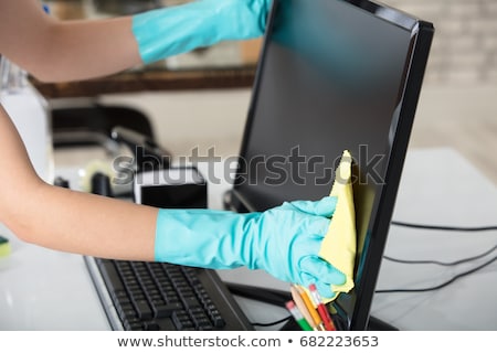 Сток-фото: Persons Hand Cleaning Desktop Screen