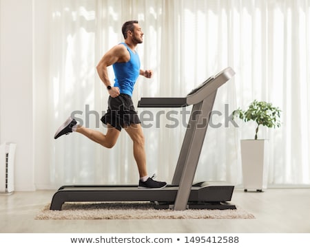 Stock fotó: Exercising On A Treadmill