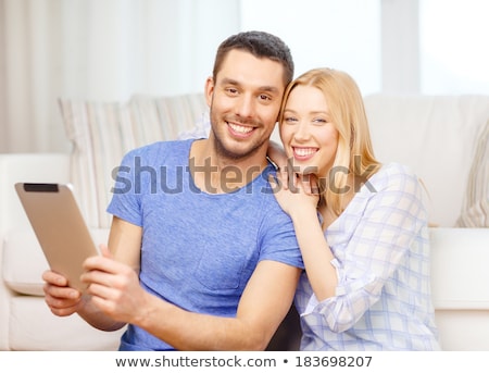 Stok fotoğraf: Happy Couple With Tablet Pc Computer At New Home