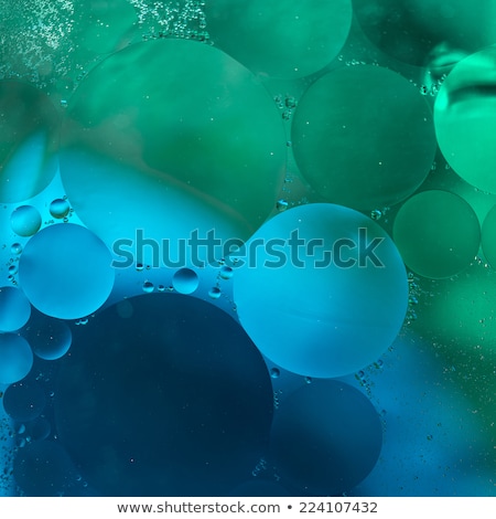 Stok fotoğraf: Greenblue Gradient Oil Drops In The Water  Abstract Background