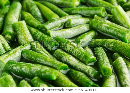 Foto stock: Wet Fresh Green French Bean In Water Macro As Background