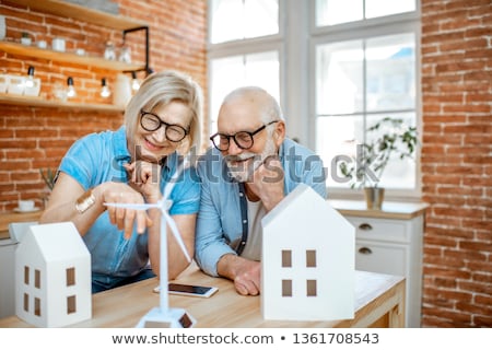 Foto stock: Woman Holding Wind Turbine Model