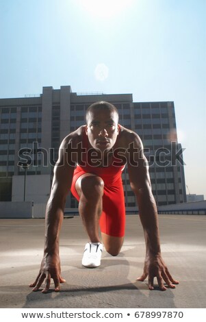 ストックフォト: Runner In Start Position On Rooftop