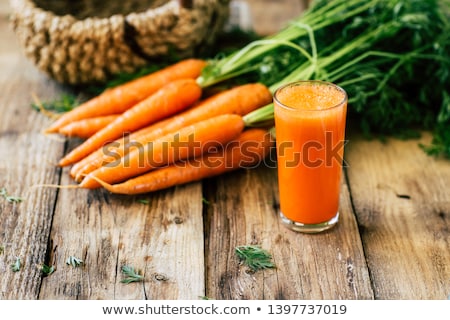 [[stock_photo]]: A Glass Of Carrot Juice With Fresh Carrots