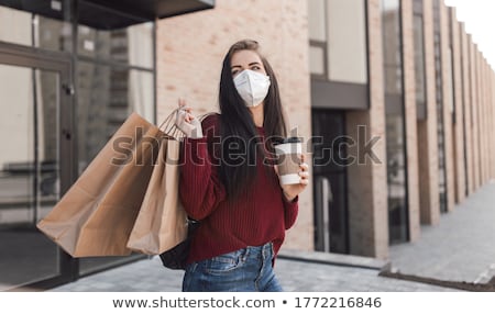 Stok fotoğraf: Happy Women With Shopping Bags Walking In City