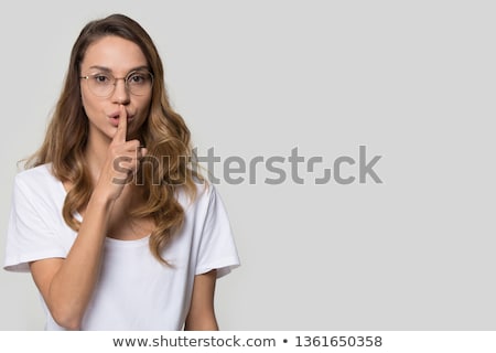 Stock photo: Young Woman Requesting For Silence Studio Shot