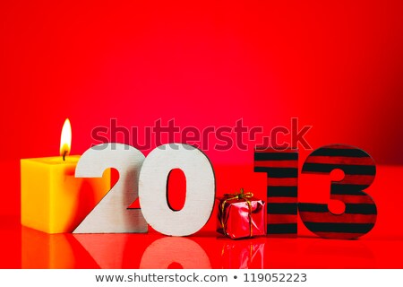 Foto d'archivio: Wooden 2013 Year Number With A Burning Candle