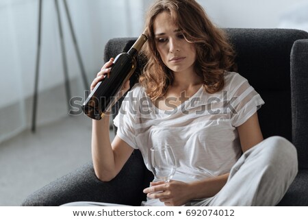 Foto stock: Woman Drinking Wine From A Bottle Loneliness And Sadness