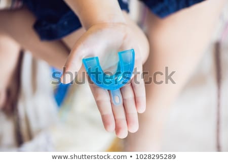 Foto stock: Six Year Old Boy Shows Myofunctional Trainer Helps Equalize The Growing Teeth And Correct Bite Dev