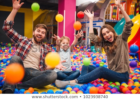 Stockfoto: The Boy Has Fun In An Indoor Playground