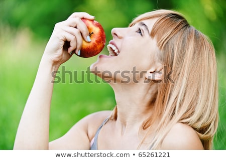 Stok fotoğraf: Woman In Profile With Red Apple