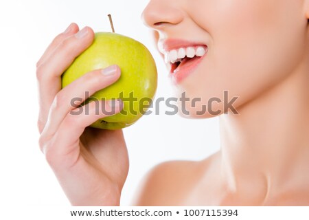 Сток-фото: Woman Biting Green Apple