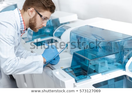 ストックフォト: Scientist Making Notes About Machine