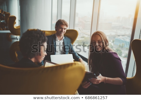 Foto stock: Silhouettes Of Office Employees On Different Floors