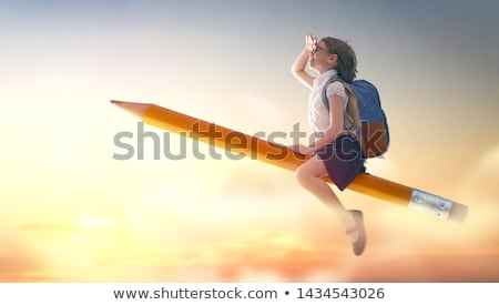 Stock photo: Child Flying On A Pencil