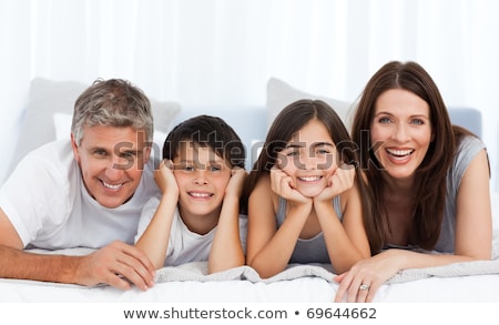 Stock foto: A Family Portrait Of Mom Dad And Their Daughter Isolated On Th