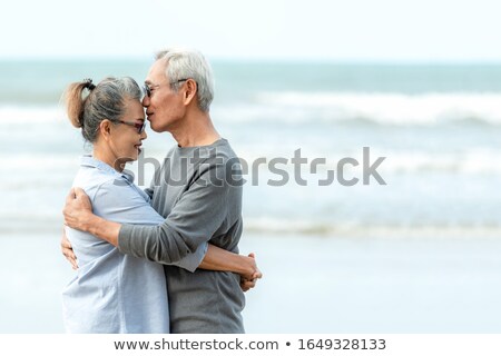 Foto stock: Couple Kissing At The Beach