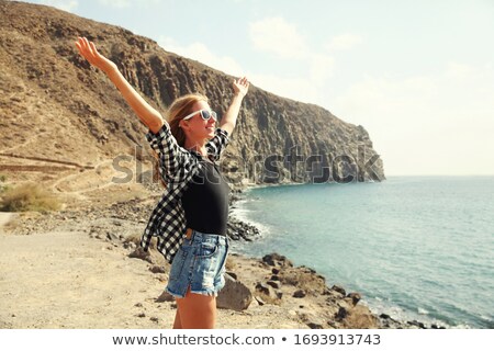 Stockfoto: Beautiful Young Smiling Girl Enjoying Over Mountain And Sea Shor