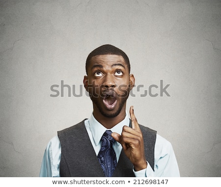 Foto stock: Excited Businessman Pointing Fingers And Looking Up
