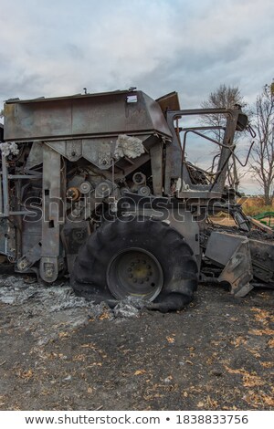 Stock photo: Combine Harvester Destroyed By Fire