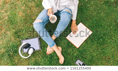 Stockfoto: Old Woman With Tablet Pc And Coffee At Summer Park