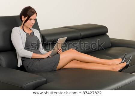 Stockfoto: Businesswoman Touch Tablet Computer Leather Sofa